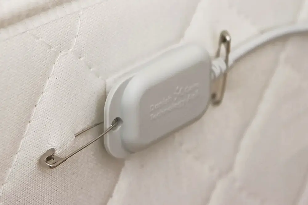 Epi-Care 3000 Mattress Sensor Epi-Care 3000 movement sensor securely attached to the side of a mattress