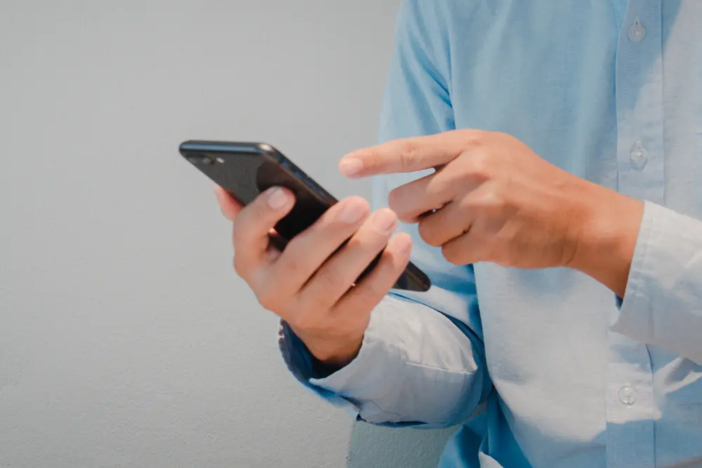Person receiving epilepsy detector alerts and notifications on a smartphone