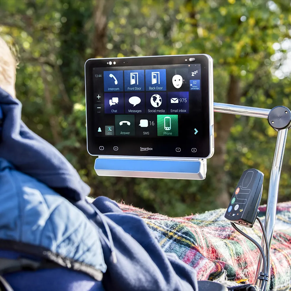 Grid Pad 13 Environmental Control in Outdoor Use Grid Pad 13 mounted on wheelchair outdoors with environmental control screen displayed