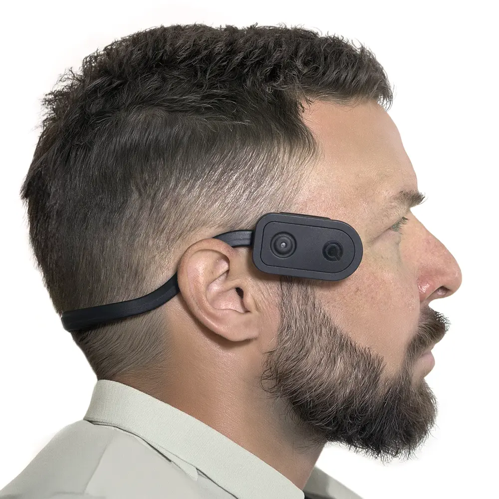 Person wearing a head mouse device to control a computer and environmental control system using hands-free head movements.