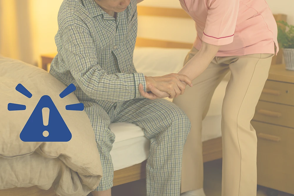 Instant Alerts to Carers Caregiver assisting an older person with instant telecare alert icon overlay