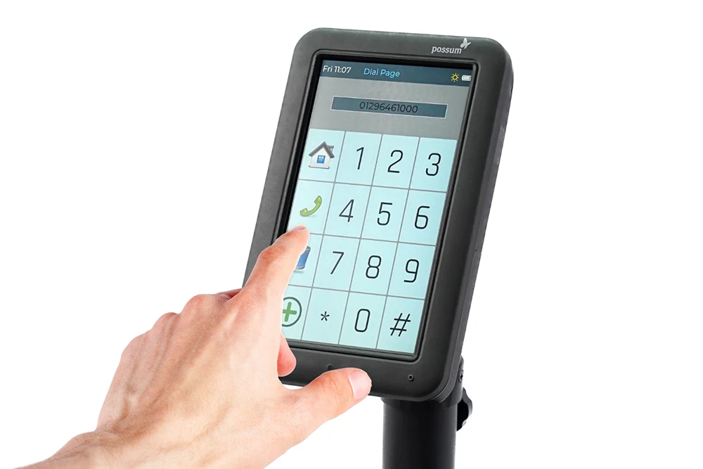 Primo Pro Touch Screen Interface Person using Primo Pro touch screen interface with large buttons for simple and accessible communication control