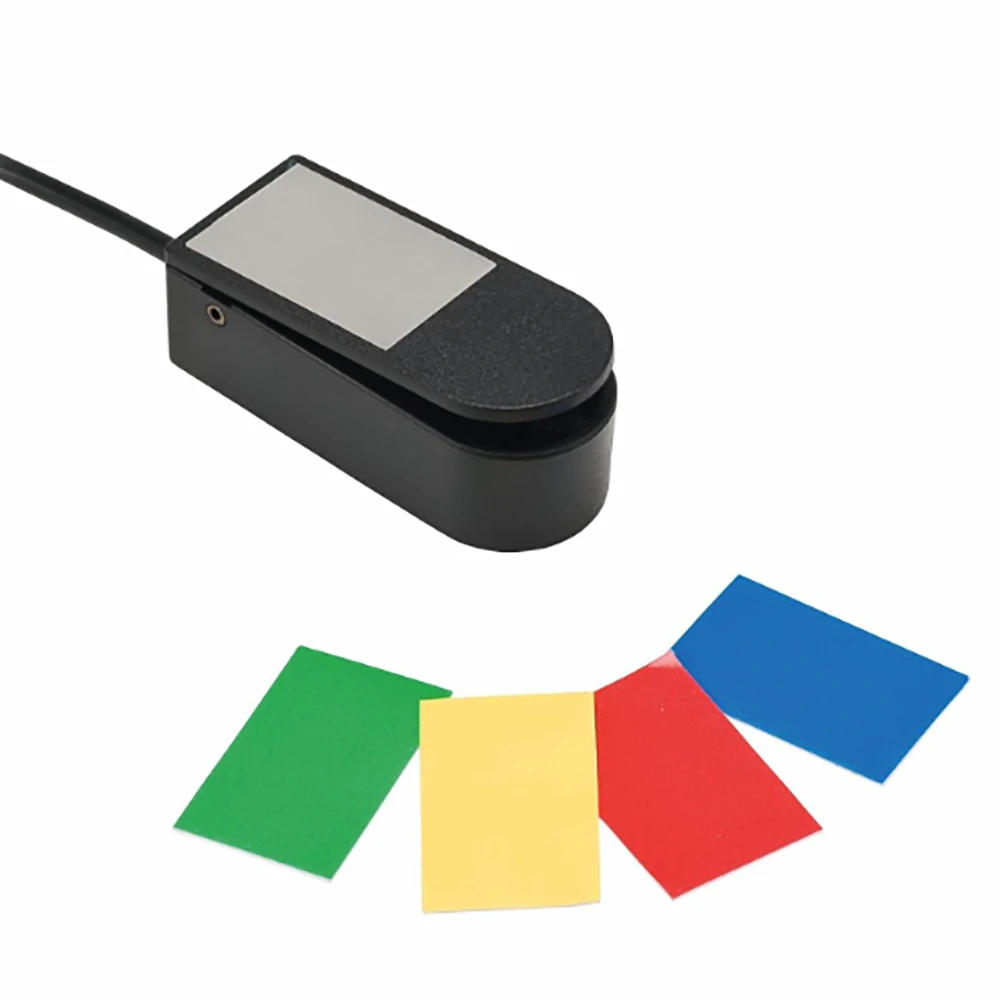 Micro Light Switch with ultra-sensitive touch activation and interchangeable coloured tops for assistive technology access