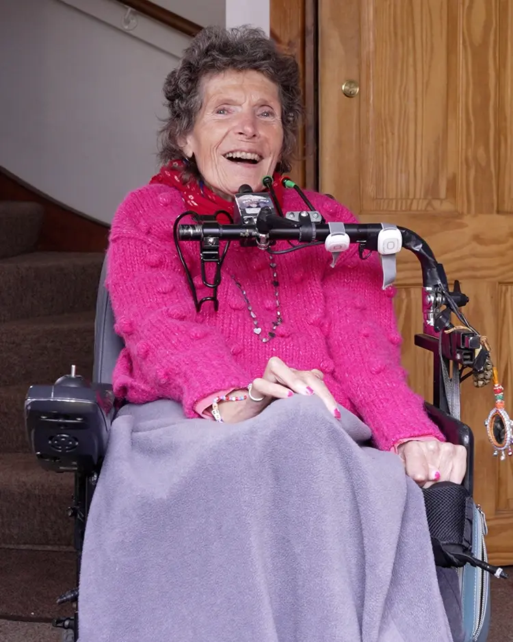 Accessing Environmental Control Systems woman using environmental control system from wheelchair to operate devices independently