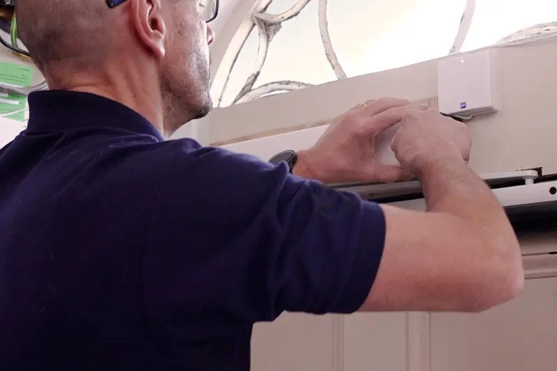 Automatic Door Opener Installation Engineer installing an automatic door opener system to improve accessibility and independent living support