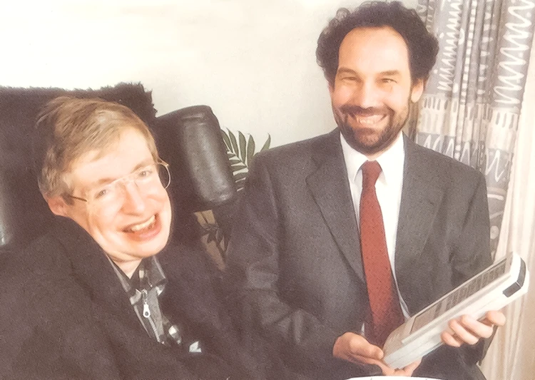 Professor Stephen Hawking pictured with an early Possum assistive communication device designed to support independence and environmental control
