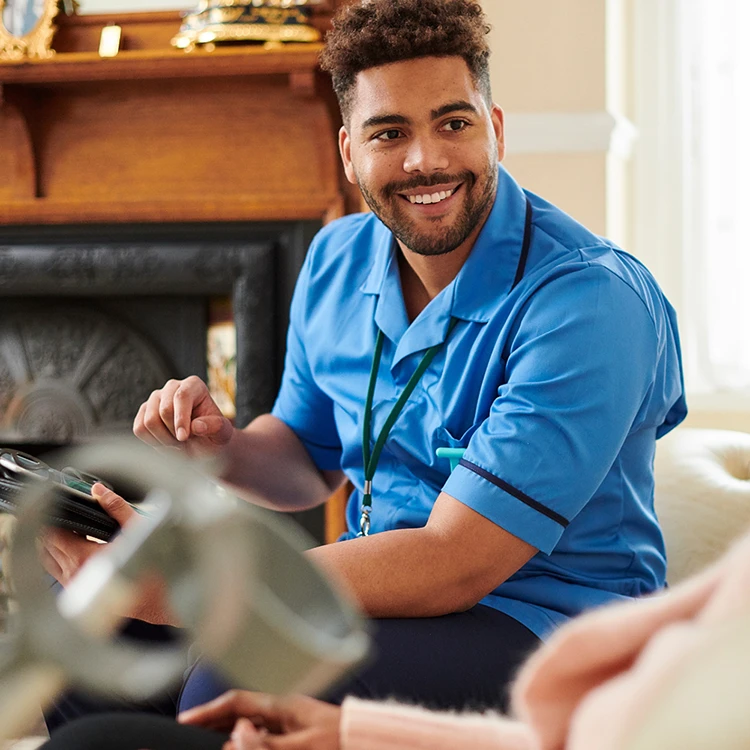 Domiciliary Care Support Domiciliary care worker providing support during a home care visit