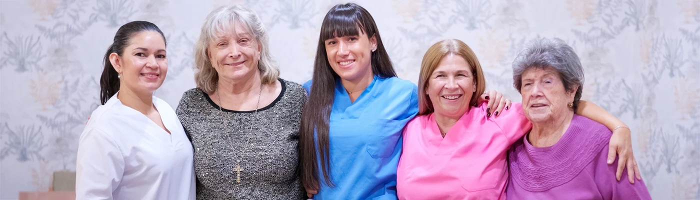 Staff Protection Solutions for Safer Care Environments Care home staff and residents together, representing staff protection solutions and safer care environments