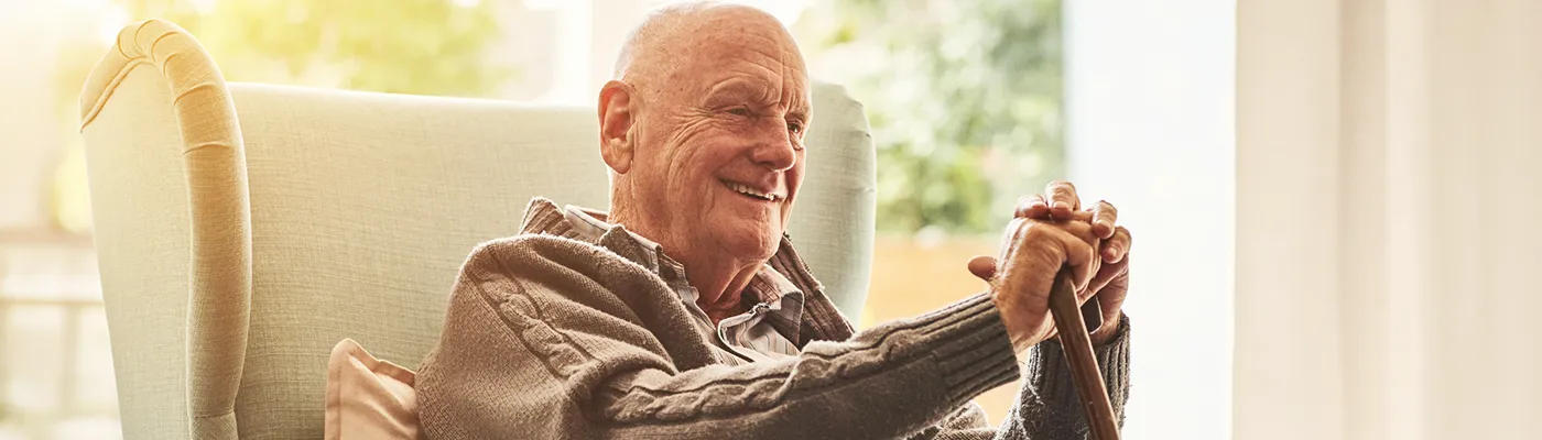 Independent Living Falls Prevention | Telecare at Home | Possum Older man relaxing safely at home, illustrating how telecare supports independent living and helps reduce the risk of falls.